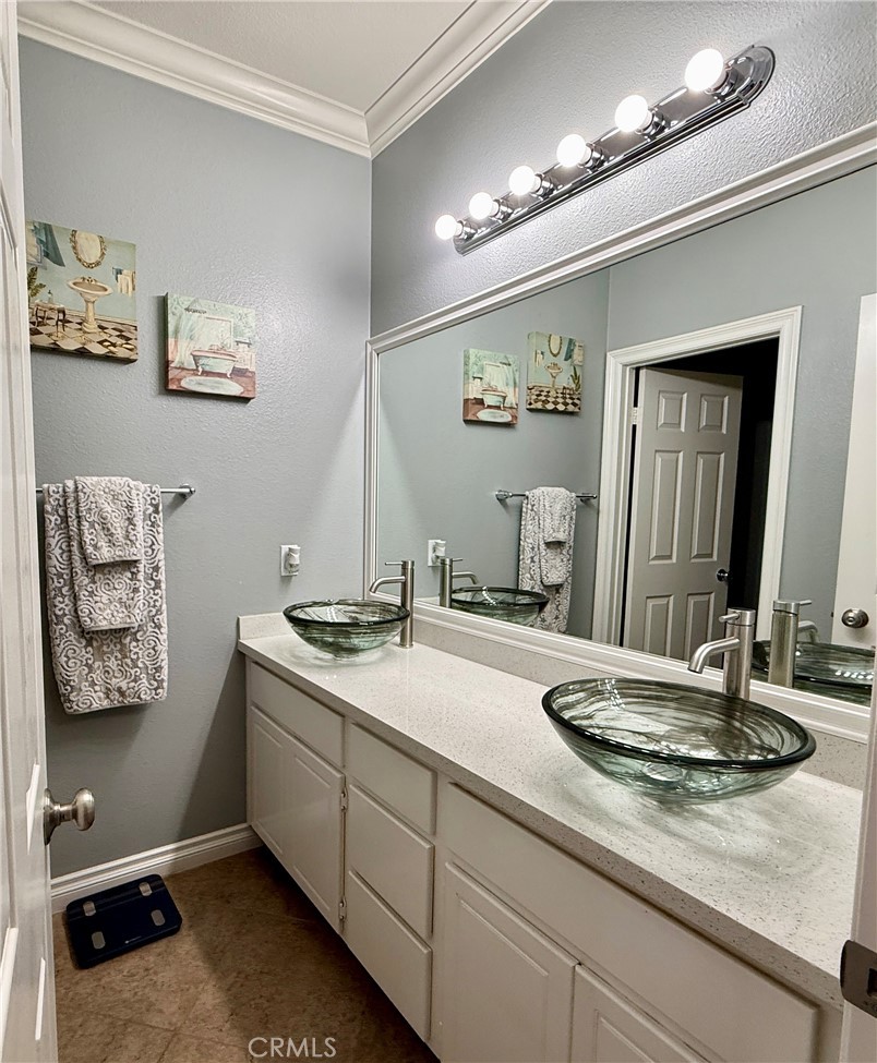 33467 Pitman Lane Menifee, CA 92584 - Photo 21 of 40 a bathroom with a sink double vanity and a mirror