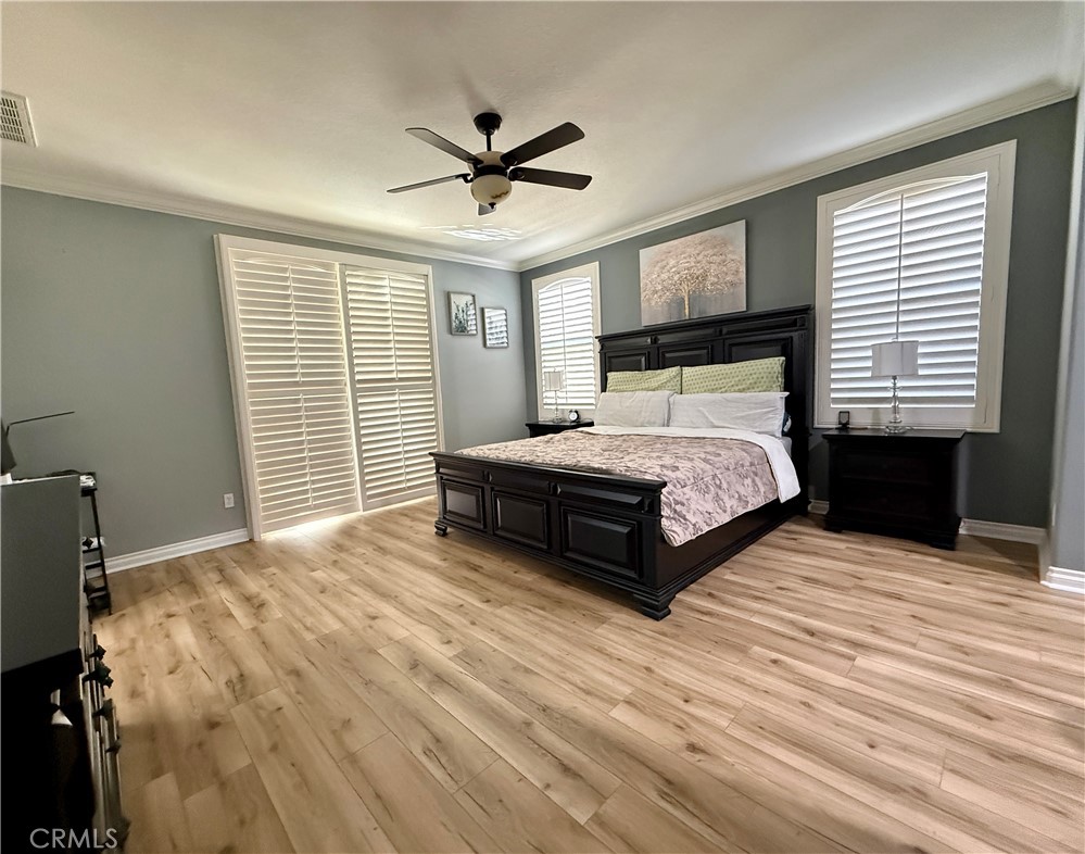 33467 Pitman Lane Menifee, CA 92584 - Photo 23 of 40 a bedroom with a bed and a ceiling fan
