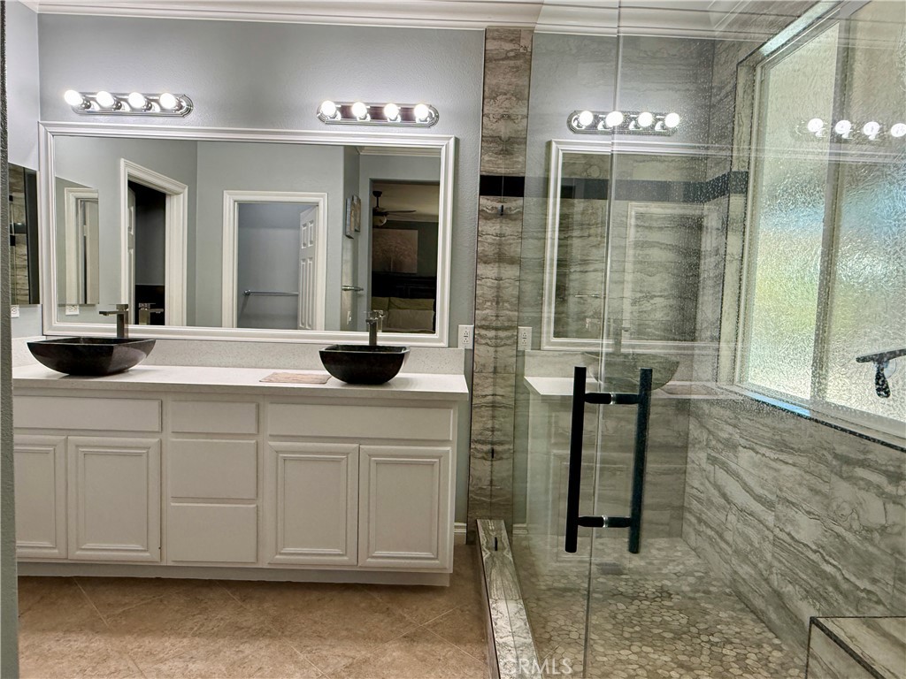 33467 Pitman Lane Menifee, CA 92584 - Photo 26 of 40 a bathroom with a sink and a mirror