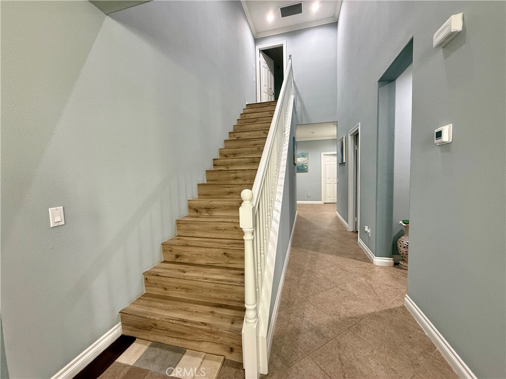 33467 Pitman Lane Menifee, CA 92584 - Photo 29 of 40 a view of a hallway with staircase