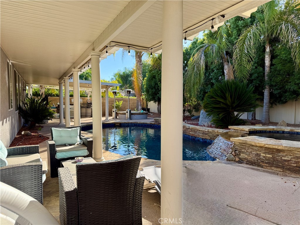 33467 Pitman Lane Menifee, CA 92584 - Photo 30 of 40 a balcony with furniture and a potted plant