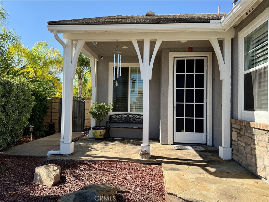 33467 Pitman Lane Menifee, CA 92584 - Photo 3 of 40 a view of a entryway door front of house