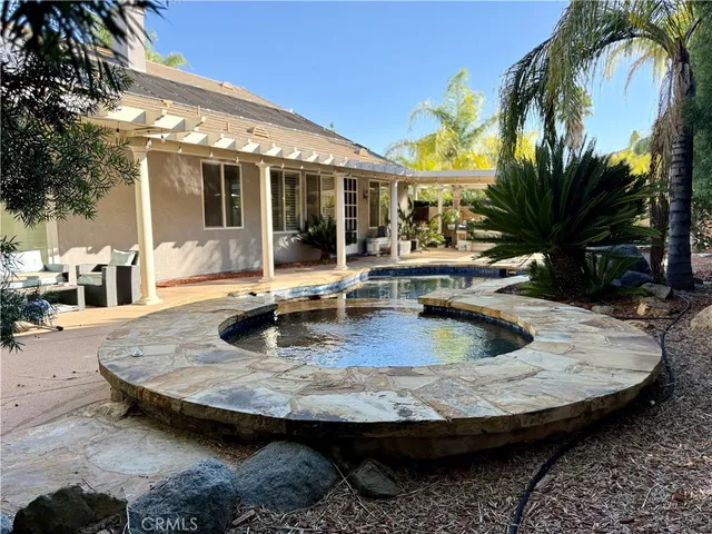 a view of a house with swimming pool
