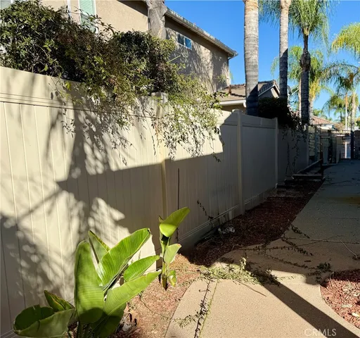 a view of a backyard of the house