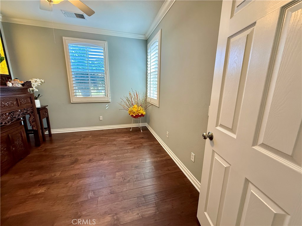 33467 Pitman Lane Menifee, CA 92584 - Photo 4 of 40 a view of an entryway with wooden floor