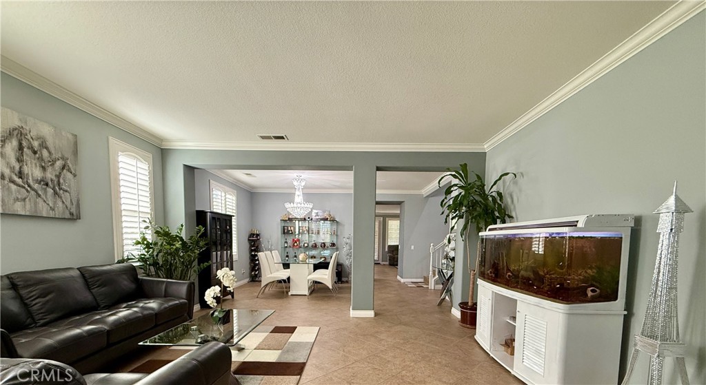 33467 Pitman Lane Menifee, CA 92584 - Photo 5 of 40 a living room with furniture and a flat screen tv