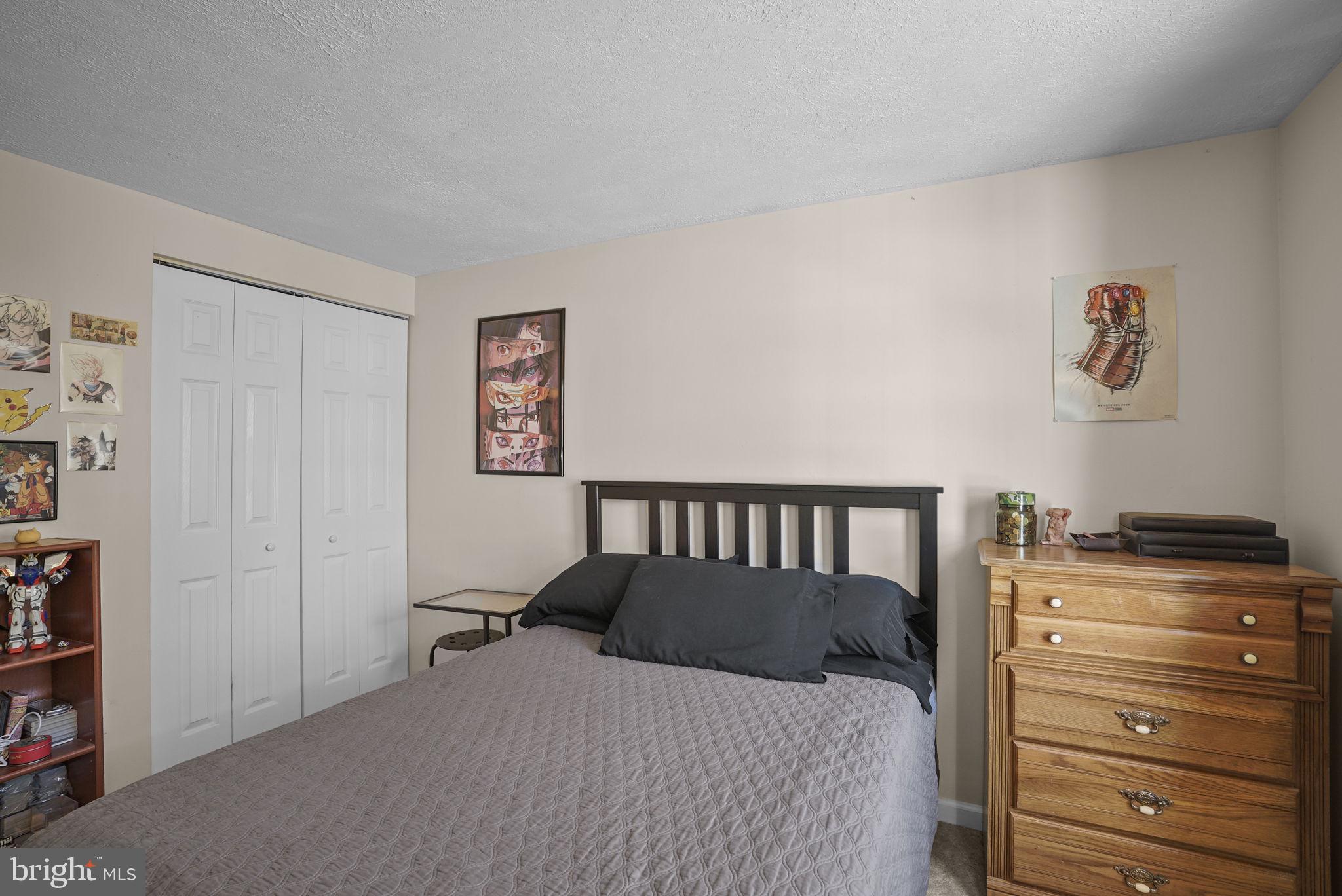 7129 Banjo Court Columbia, MD 21045 - Photo 16 of 46 a bedroom with a bed and a cabinet