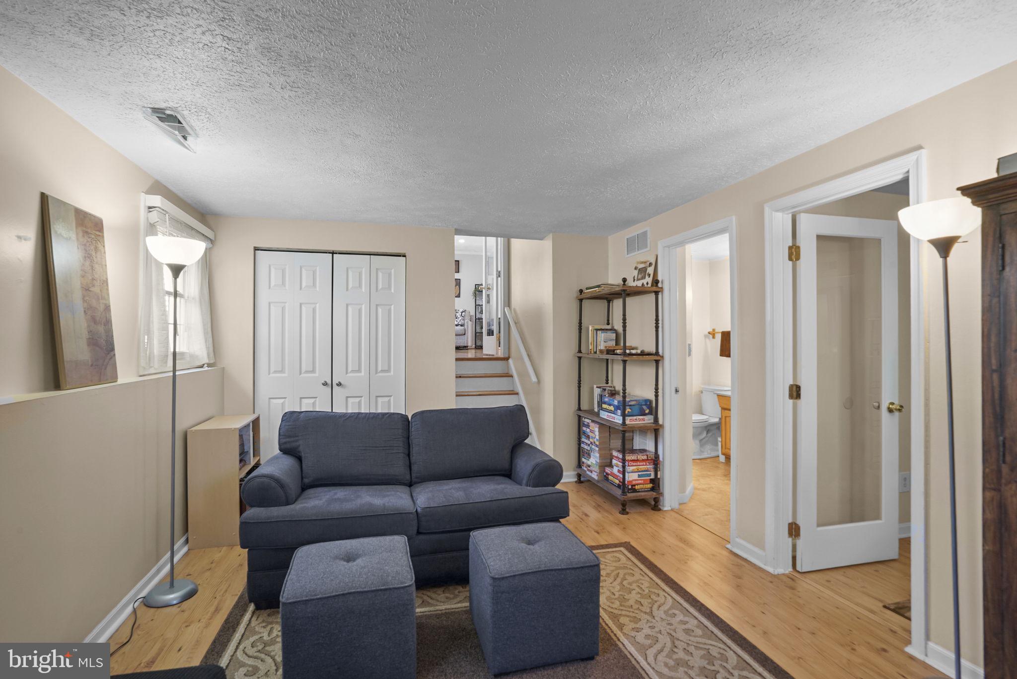 7129 Banjo Court Columbia, MD 21045 - Photo 18 of 46 a living room with furniture and a wooden floor