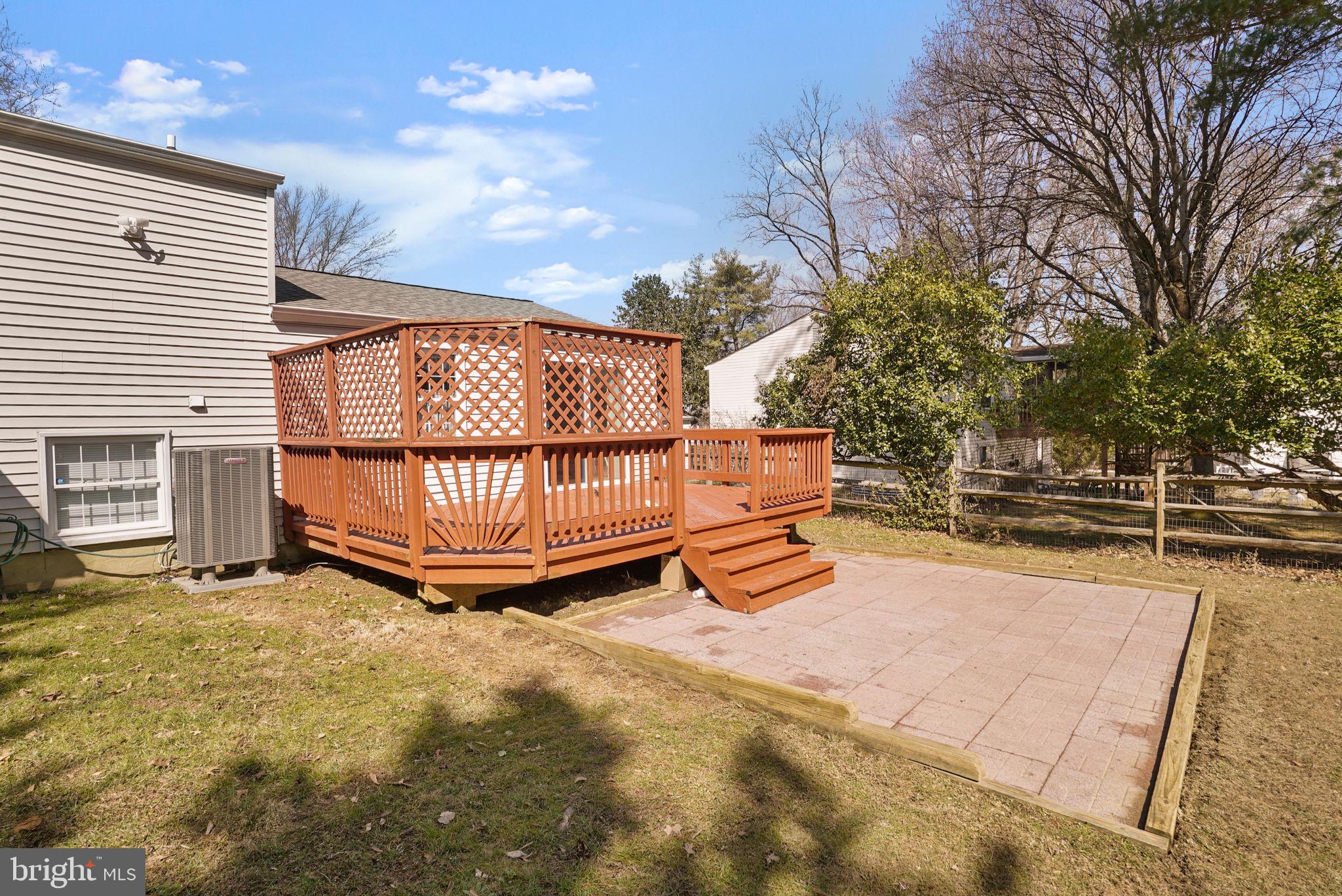 7129 Banjo Court Columbia, MD 21045 - Photo 27 of 46 a view of backyard with a garden and deck