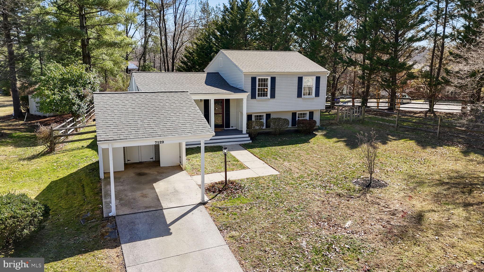 7129 Banjo Court Columbia, MD 21045 - Photo 32 of 46 a aerial view of a house with yard patio and fire pit