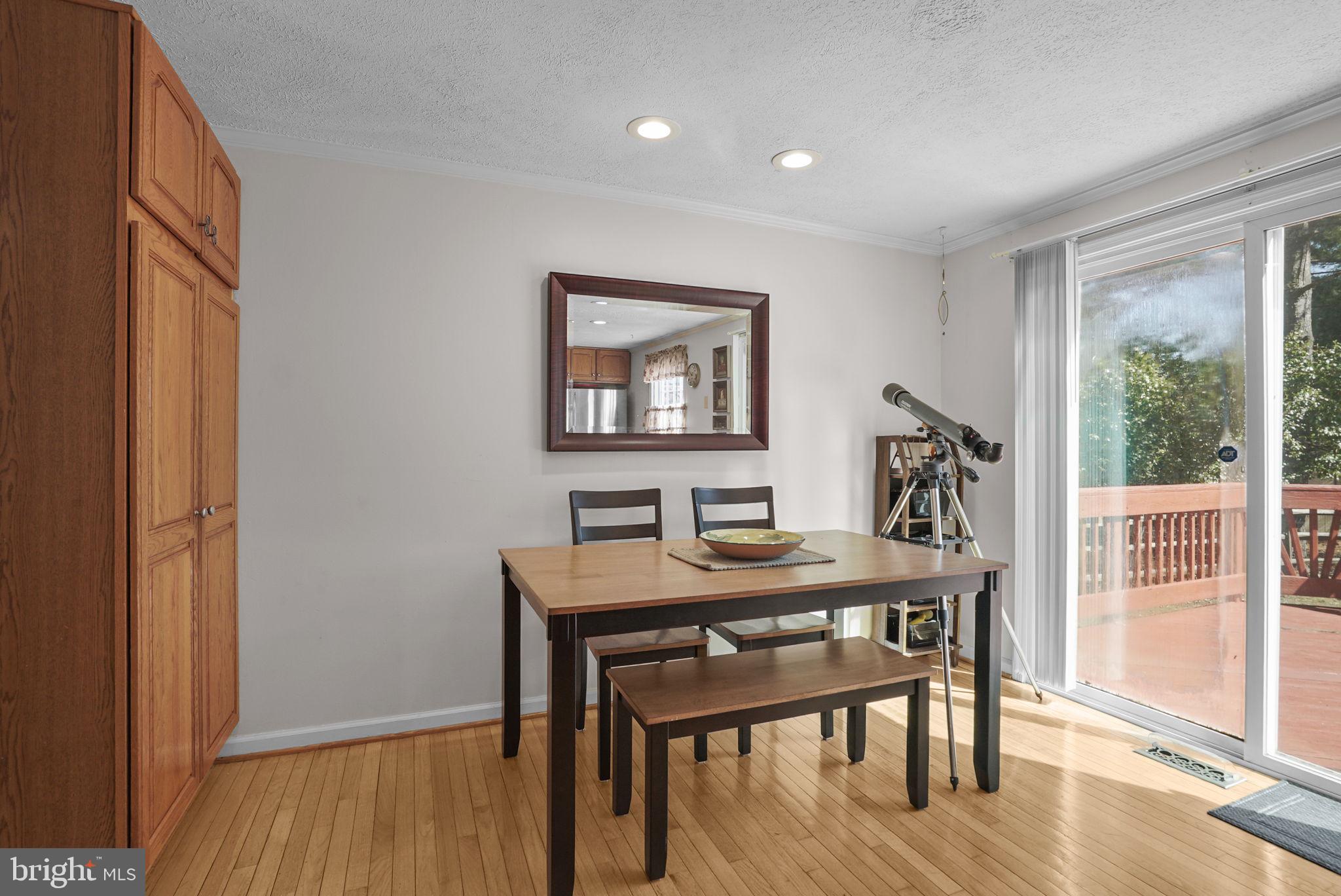 7129 Banjo Court Columbia, MD 21045 - Photo 7 of 46 a view of a dining room with furniture window and wooden floor