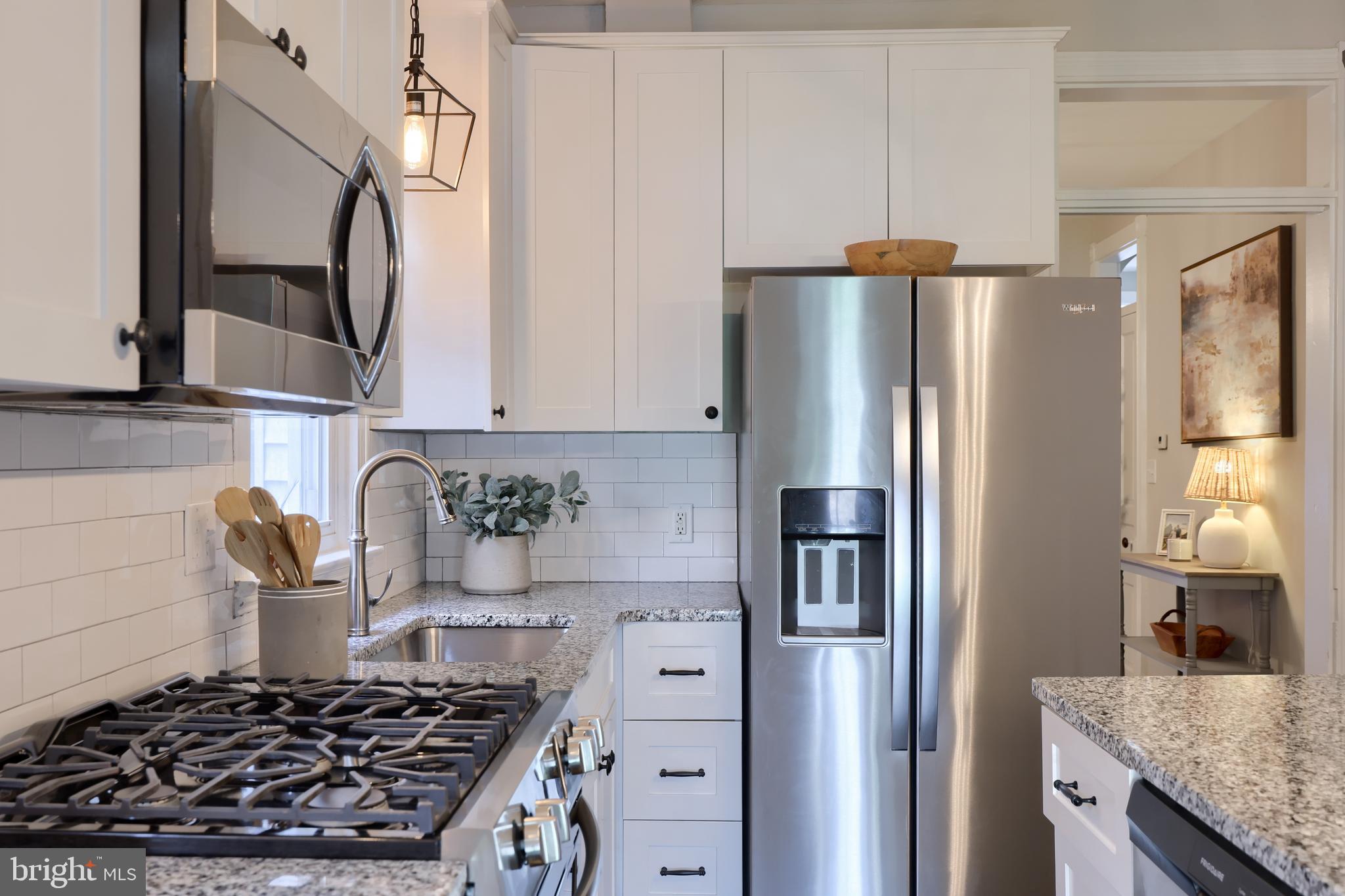 119 South Cedar Street Lititz, PA 17543 - Photo 11 of 22 a kitchen with stainless steel appliances granite countertop a refrigerator and a stove