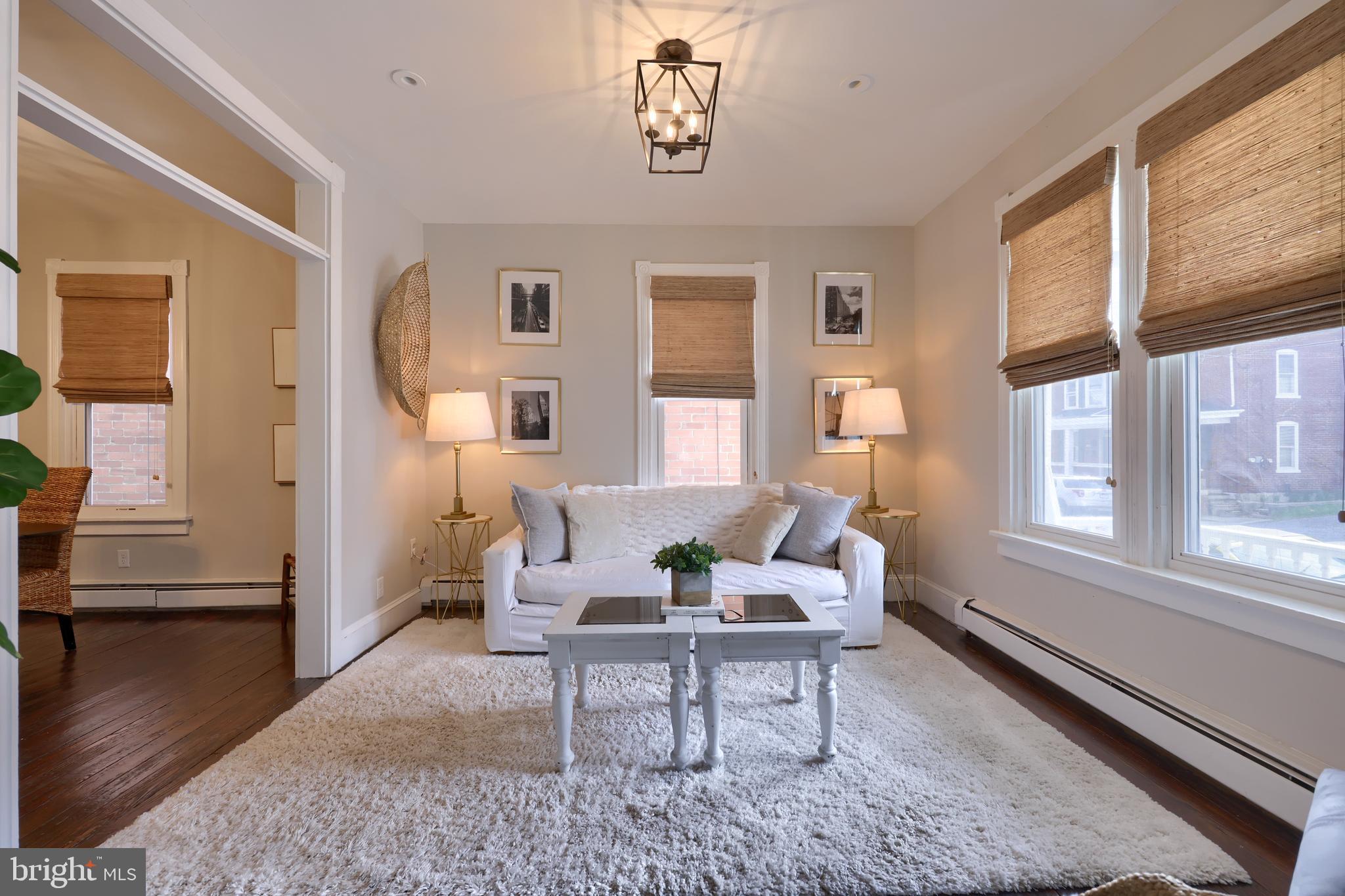 119 South Cedar Street Lititz, PA 17543 - Photo 3 of 22 a living room with furniture wooden floor and a table
