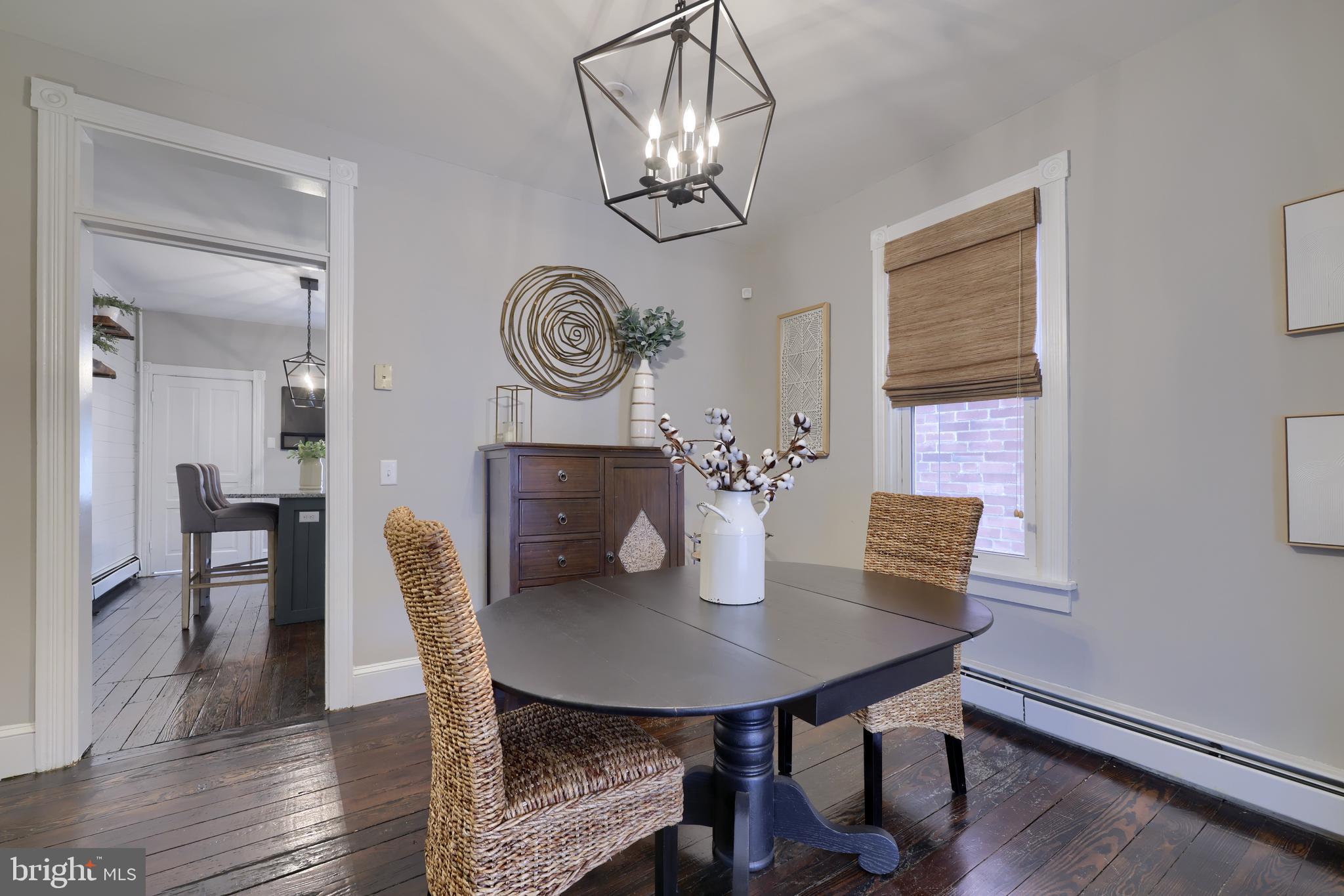 119 South Cedar Street Lititz, PA 17543 - Photo 7 of 22 a view of a dining room with furniture and wooden floor