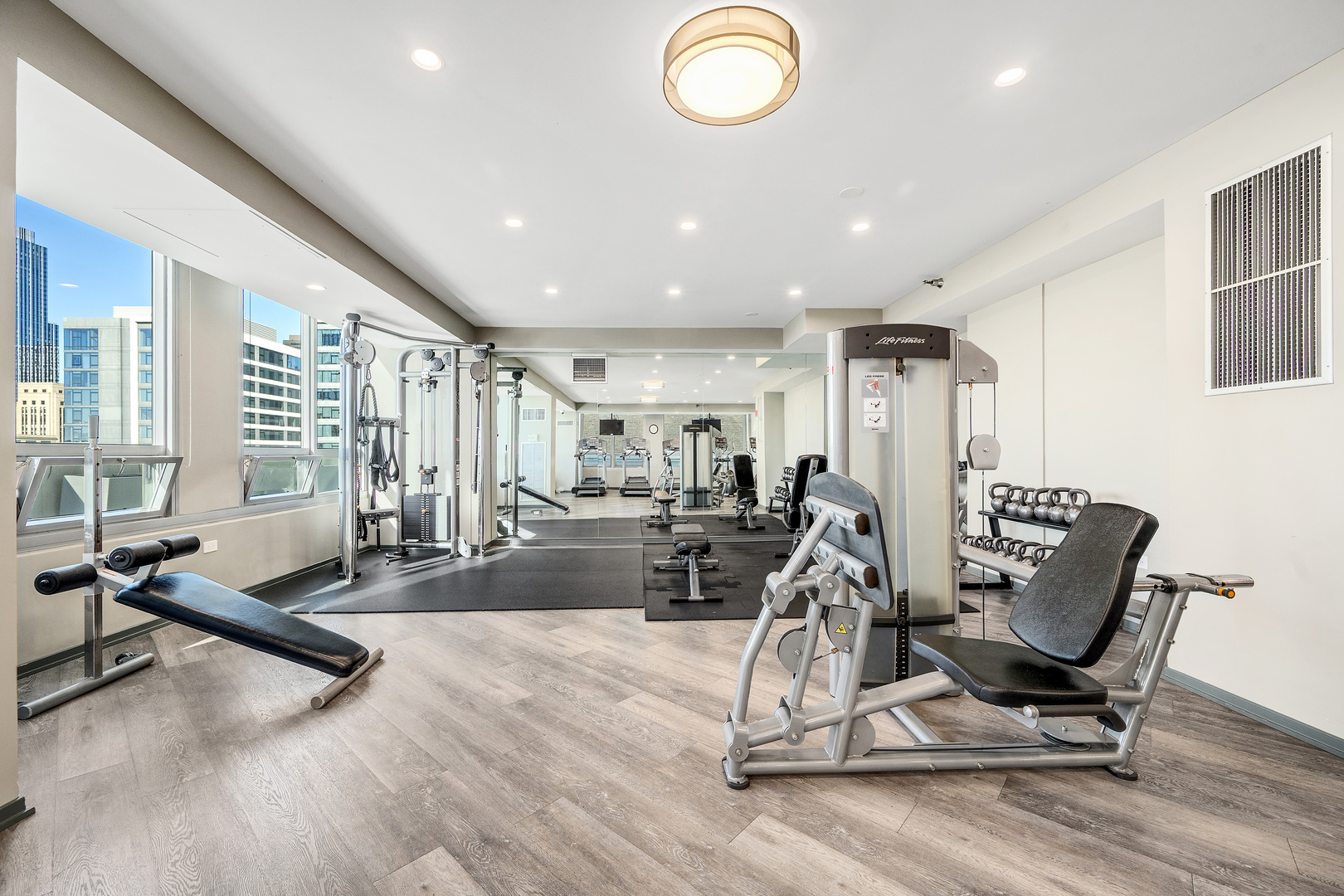701 South Wells Street, Unit 3006 Chicago, IL 60607 - Photo 28 of 32 a view of a room with gym equipment