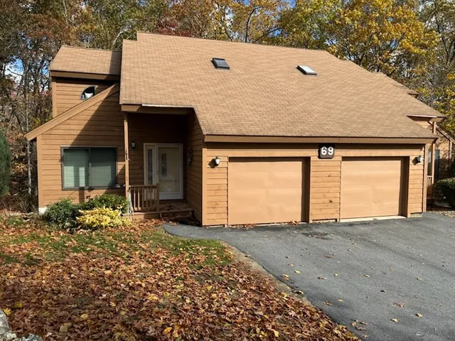 front view of a house with a large window