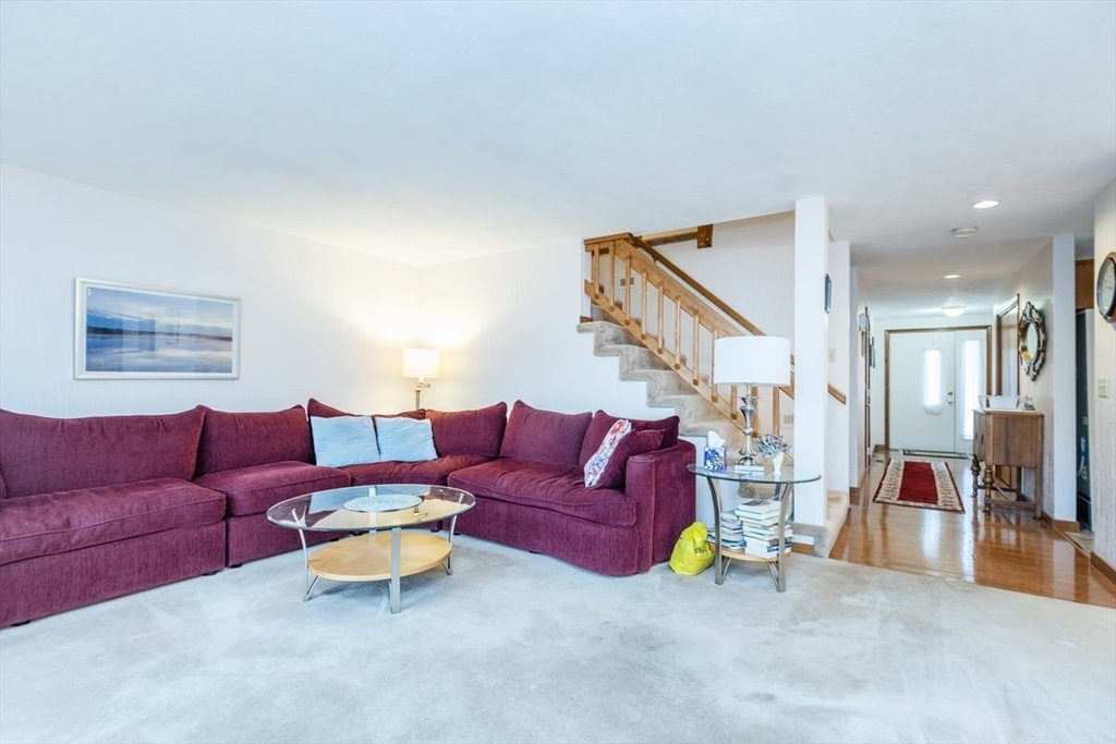 81 Clement Court, Unit 81 Haverhill, MA 01832 - Photo 11 of 36 a living room with furniture and a wooden floor