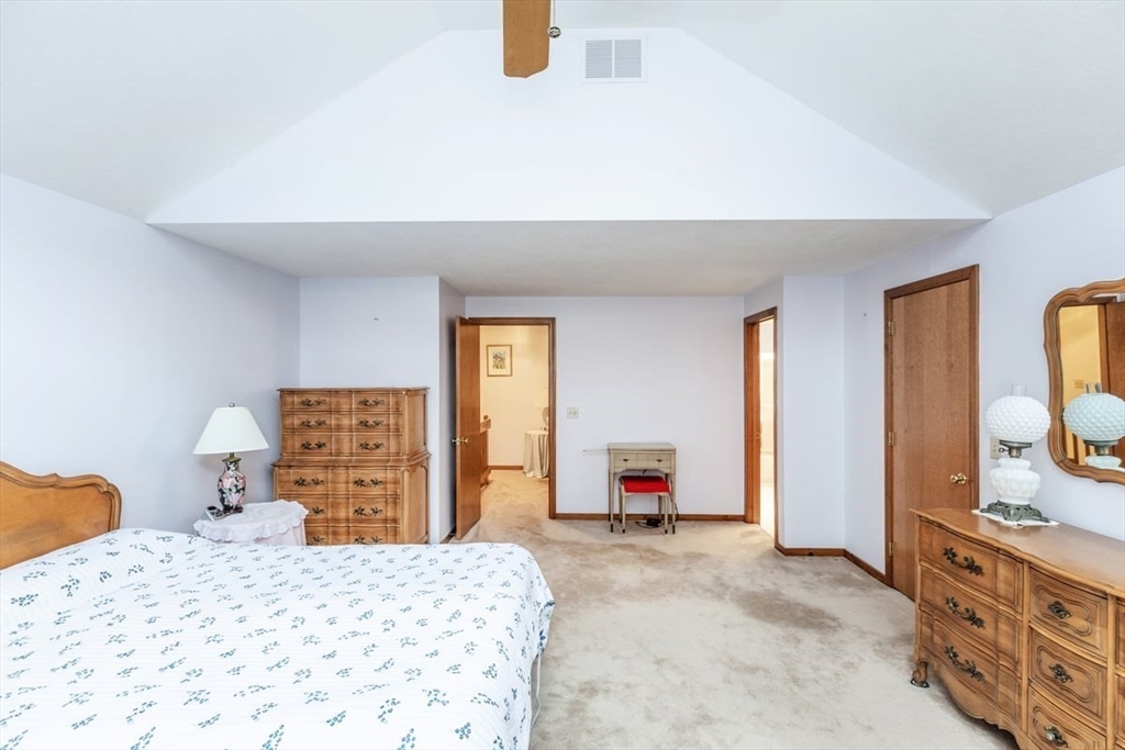 81 Clement Court, Unit 81 Haverhill, MA 01832 - Photo 19 of 36 a bedroom with a bed and dresser