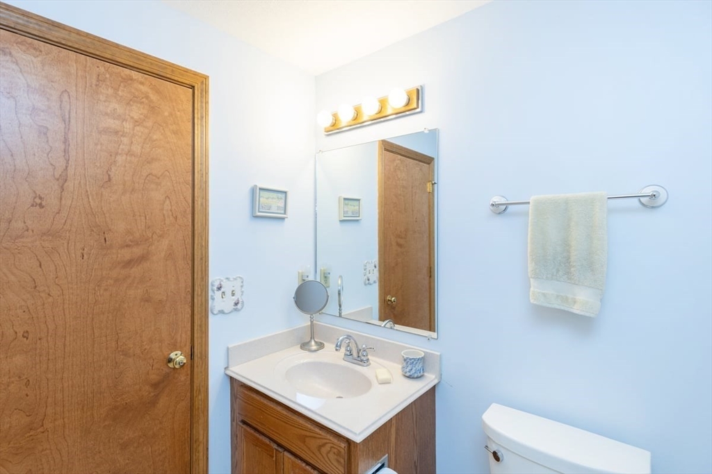 81 Clement Court, Unit 81 Haverhill, MA 01832 - Photo 28 of 36 a bathroom with a sink and a mirror