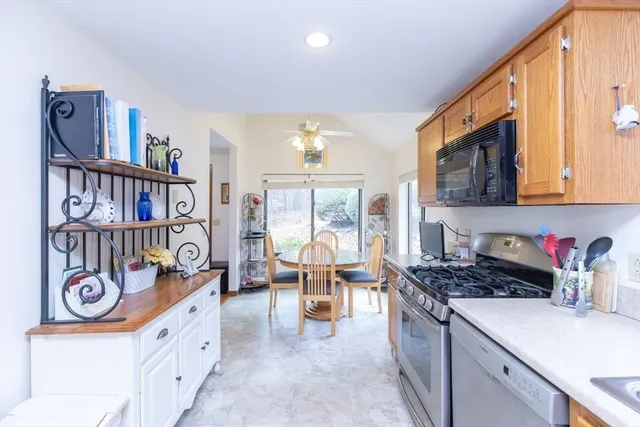 a kitchen that has a lot of cabinets in it