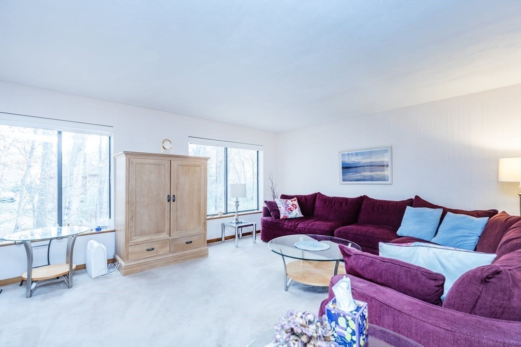 81 Clement Court, Unit 81 Haverhill, MA 01832 - Photo 10 of 36 a living room with furniture and a large window