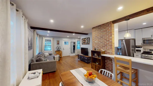 a living room with furniture fireplace and flat screen tv