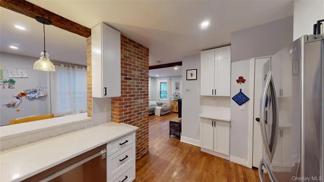 a kitchen with a refrigerator and a sink
