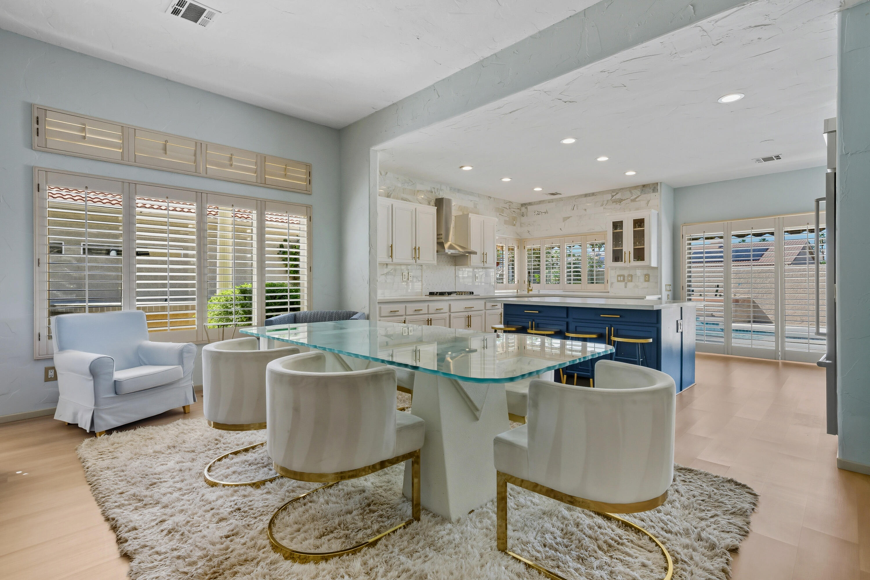 15 Florentina Drive Rancho Mirage, CA 92270 - Photo 11 of 34 a living room with furniture and a large window