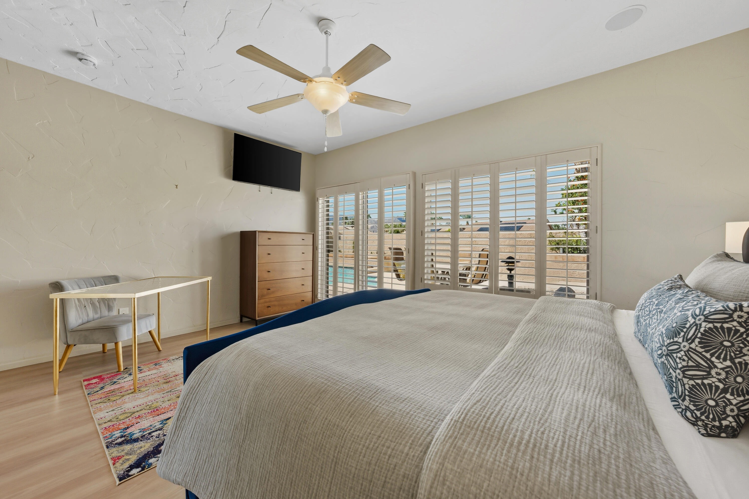 15 Florentina Drive Rancho Mirage, CA 92270 - Photo 16 of 34 a spacious bedroom with a large bed and a large window