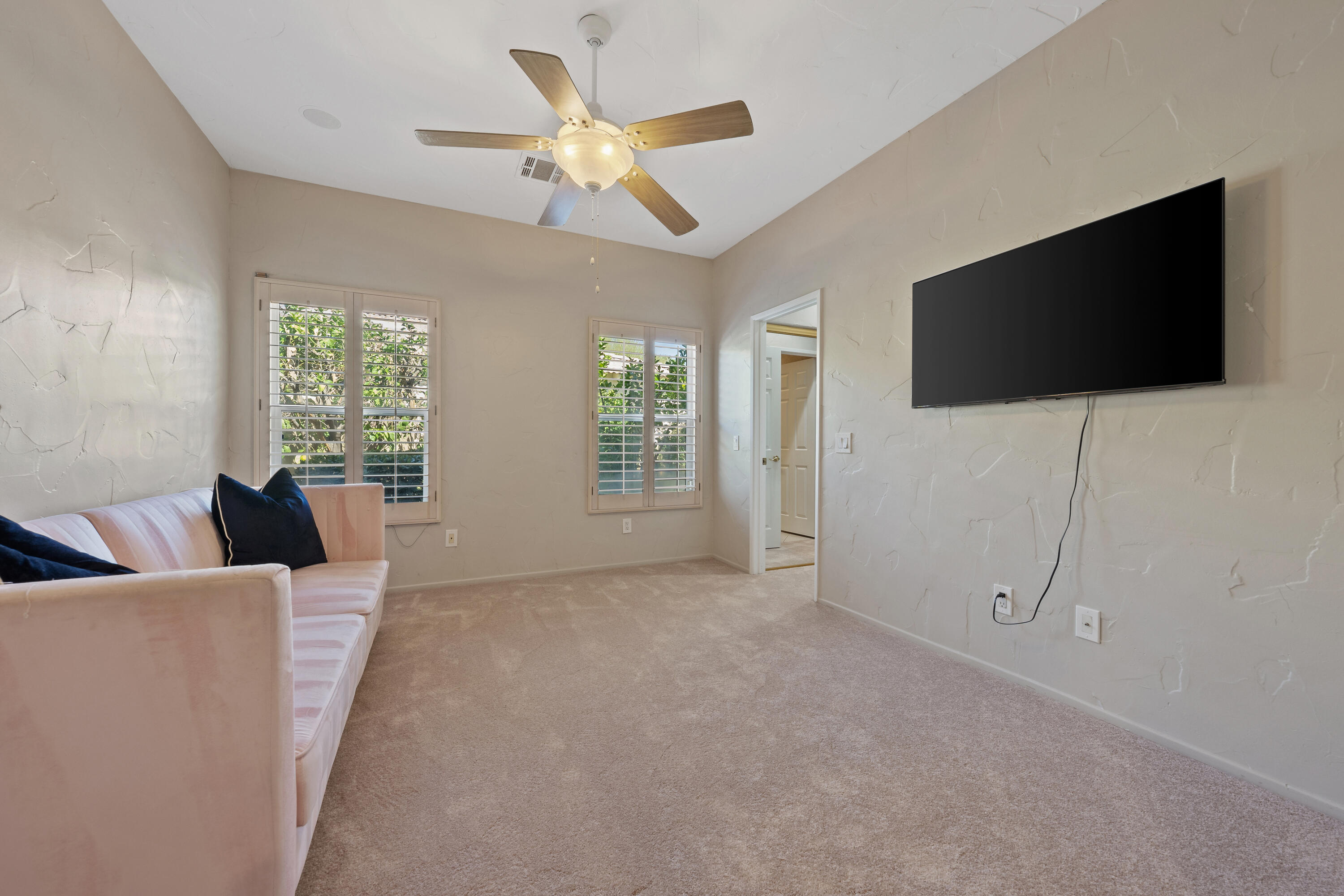15 Florentina Drive Rancho Mirage, CA 92270 - Photo 21 of 34 a living room with furniture and a flat screen tv