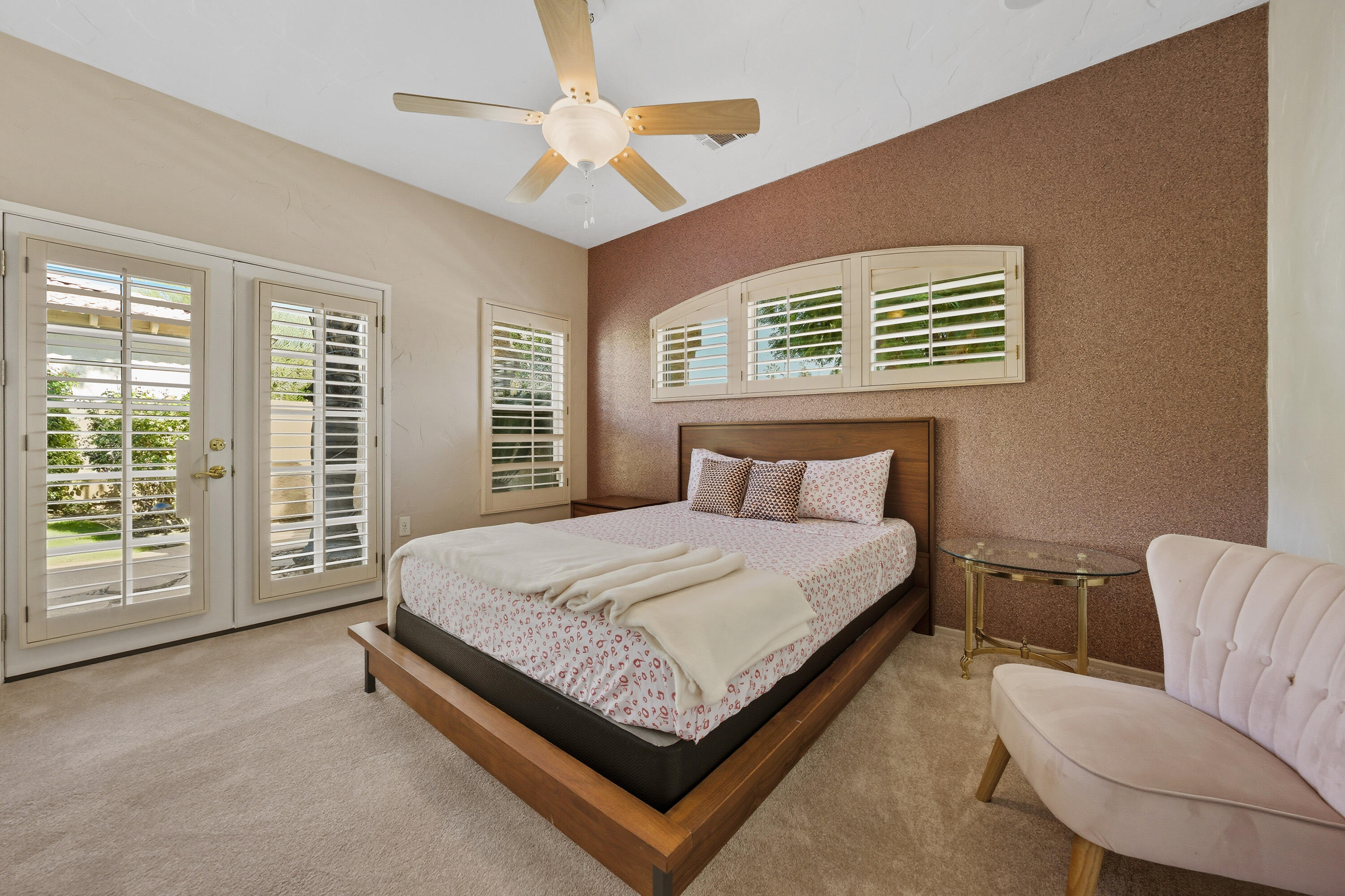 15 Florentina Drive Rancho Mirage, CA 92270 - Photo 22 of 34 a bedroom with a large bed and a couch