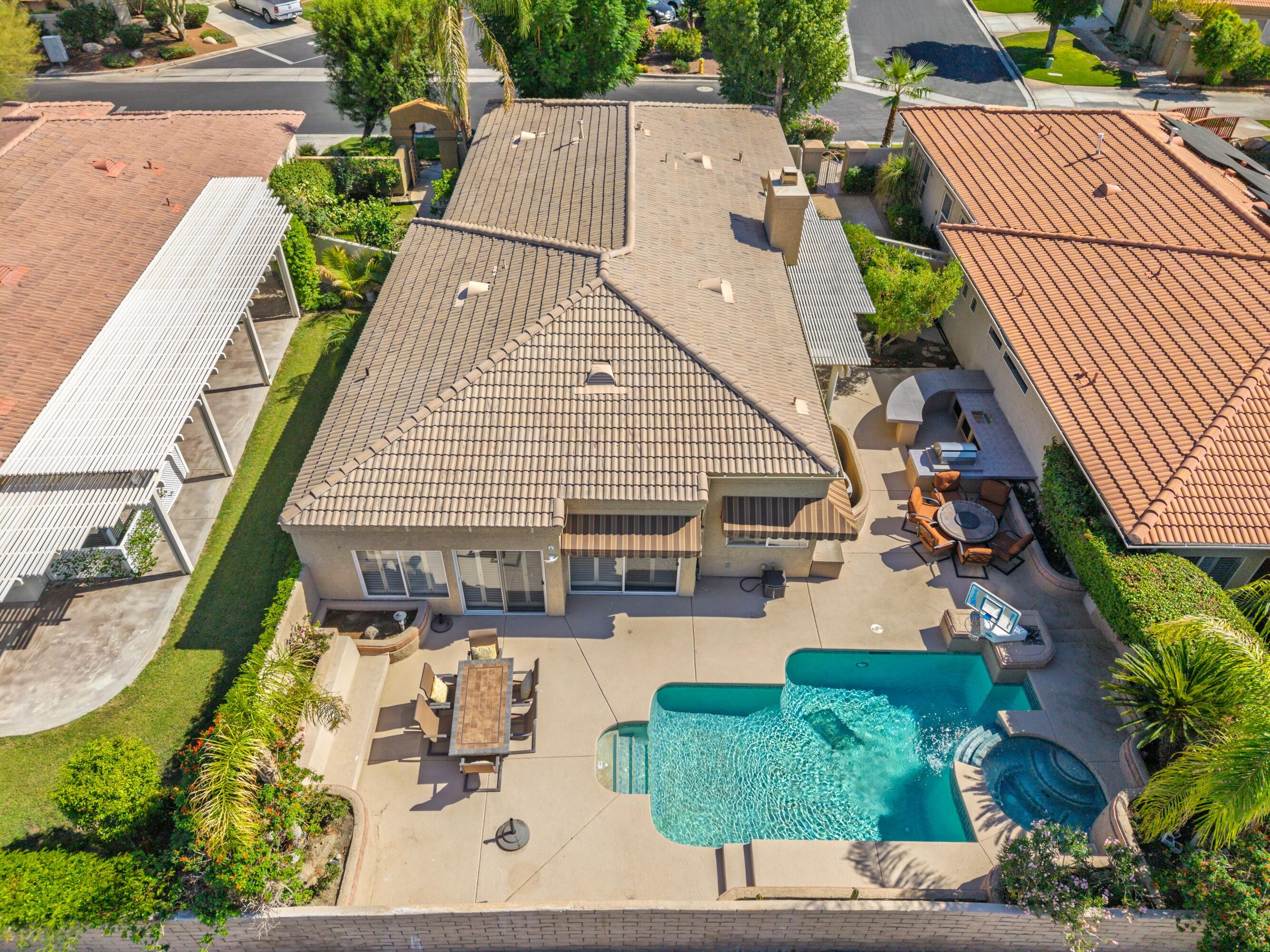 15 Florentina Drive Rancho Mirage, CA 92270 - Photo 26 of 34 an aerial view of a house with swimming pool and patio