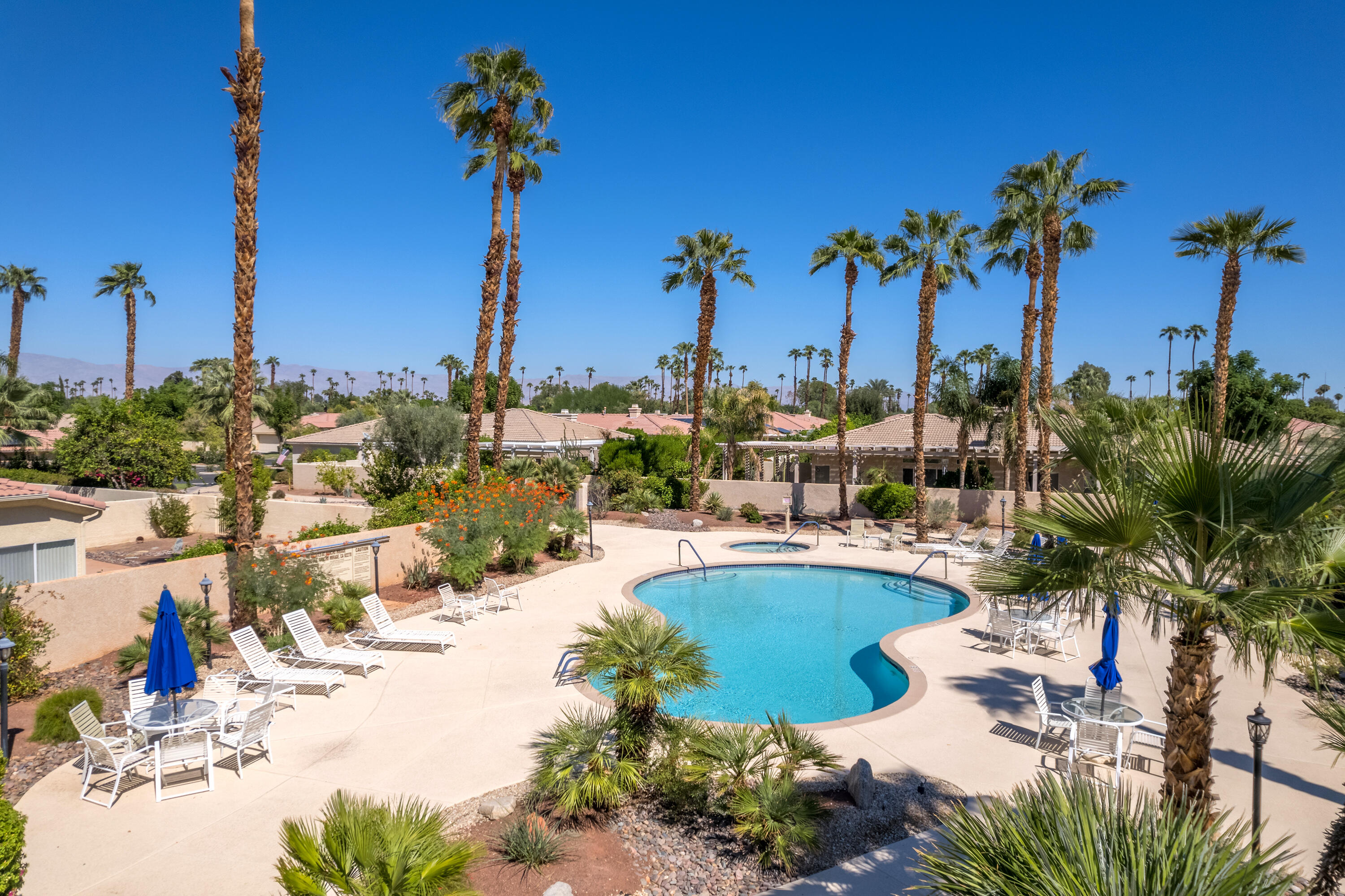 15 Florentina Drive Rancho Mirage, CA 92270 - Photo 33 of 34 a view of a lake with boats and palm trees