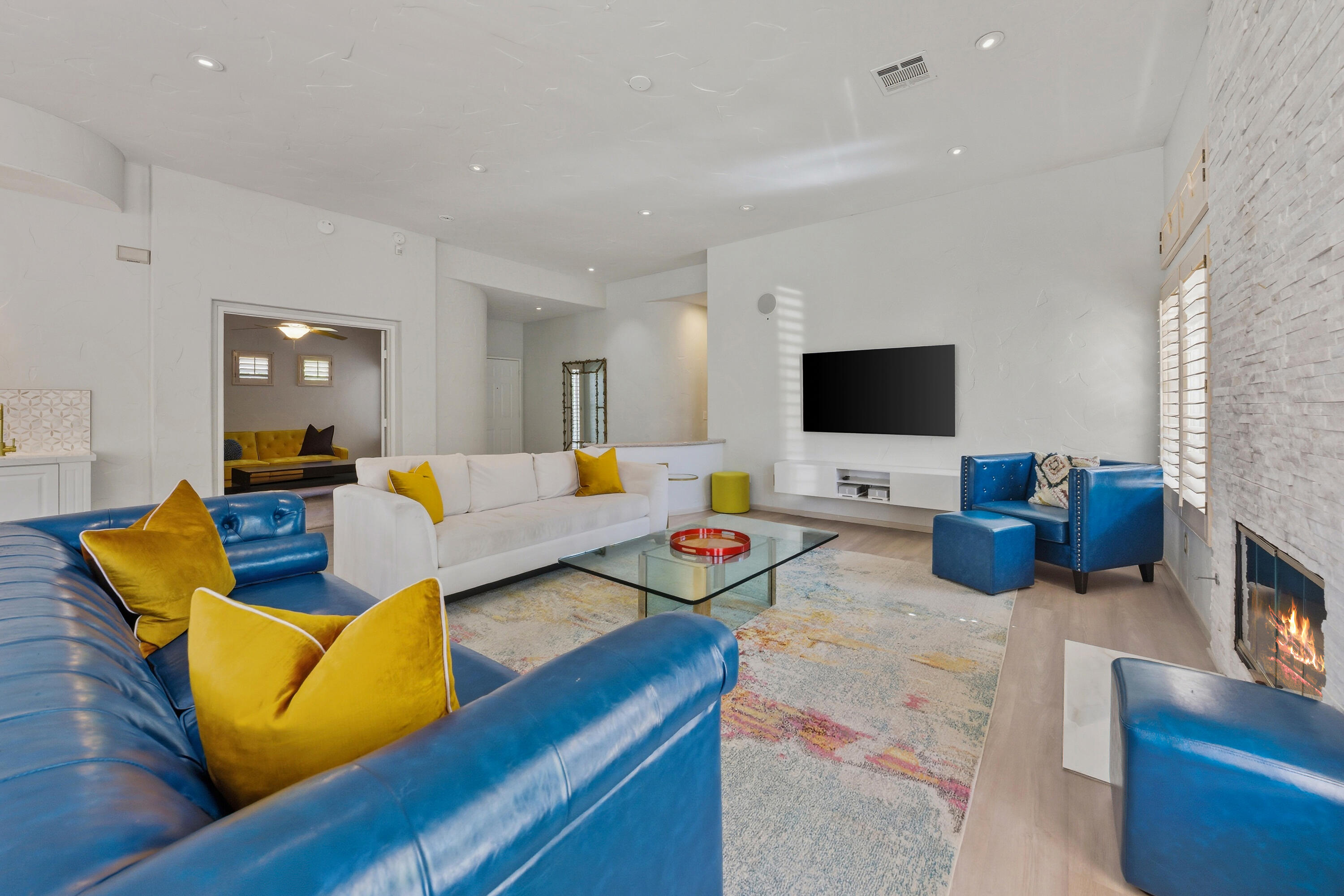 15 Florentina Drive Rancho Mirage, CA 92270 - Photo 9 of 34 a living room with furniture and a flat screen tv