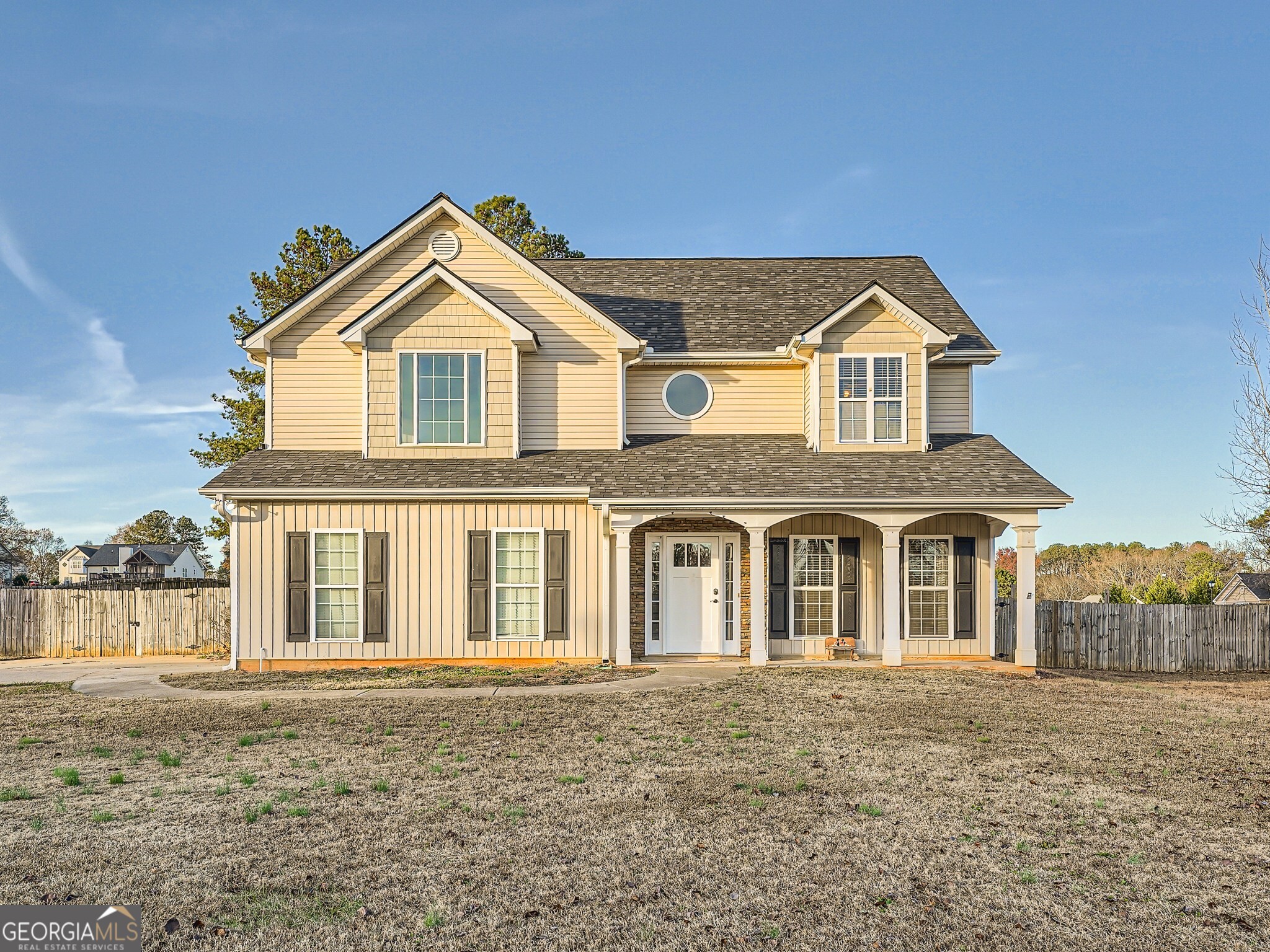 front view of a house with a yard
