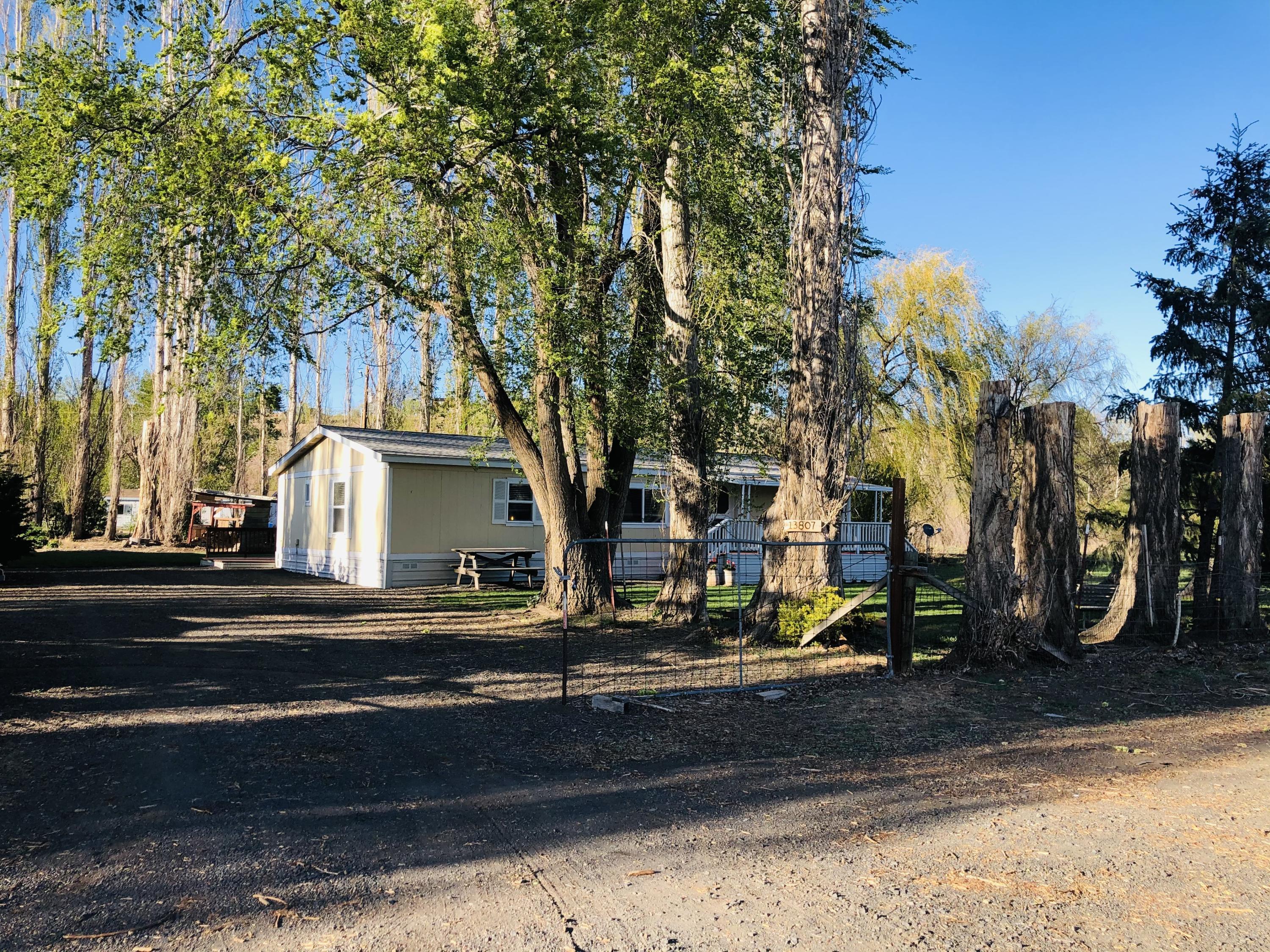 13807 Knox Road Yakima, WA 98908 - Photo 5 of 30 a view of street along with trees