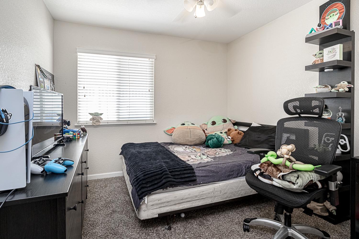 628 Mission Ridge Drive Manteca, CA 95337 - Photo 17 of 27 a bedroom with a bed and a window