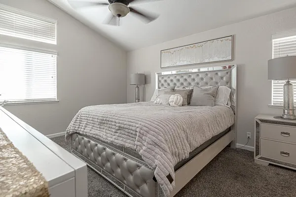 a bedroom with a bed and window