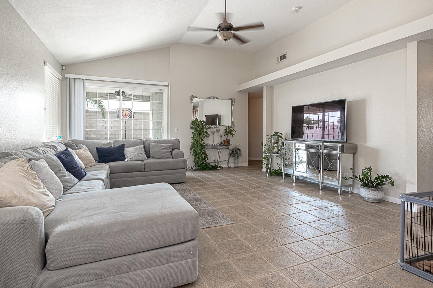 628 Mission Ridge Drive Manteca, CA 95337 - Photo 7 of 27 a living room with furniture and a window