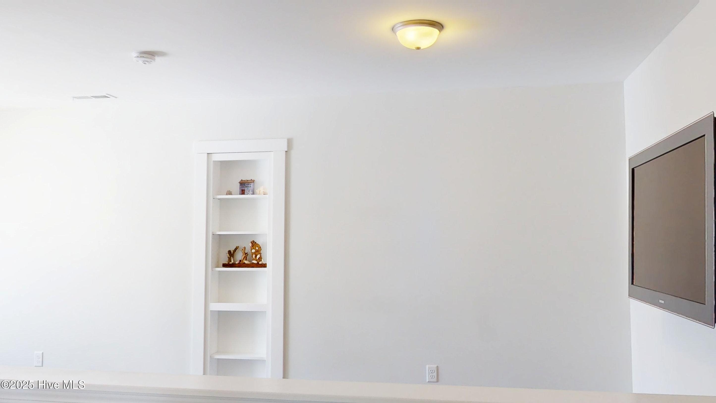 3363 Kellerton Place Wilmington, NC 28409 - Photo 15 of 32 Access to Storage area is via the Secret Door/Built in Shelf in Loft Area shown here.