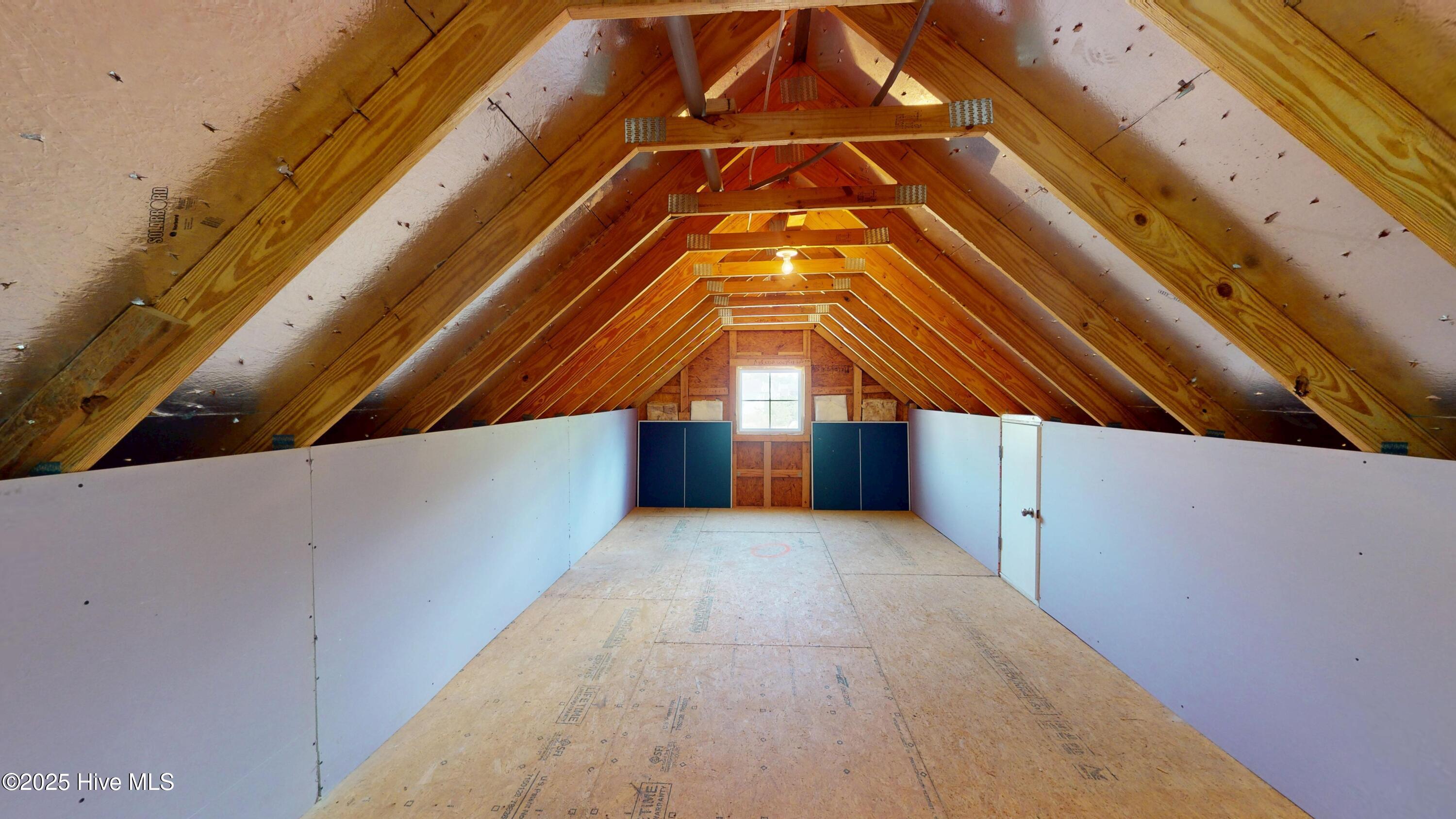 3363 Kellerton Place Wilmington, NC 28409 - Photo 16 of 32 This is the storage area behind the secret door/built in shelf in Loft Area.