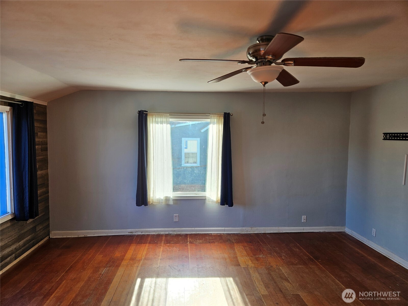 2625 Bench Drive Aberdeen, WA 98520 - Photo 4 of 16 a view of an empty room with wooden floor and a window