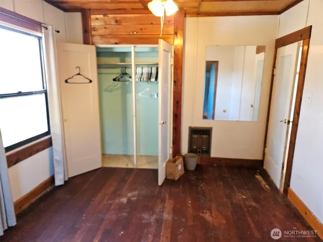 a view of a bathroom with a tub and shower