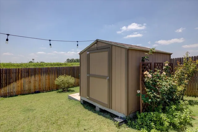 a backyard view with hardwood and lake view