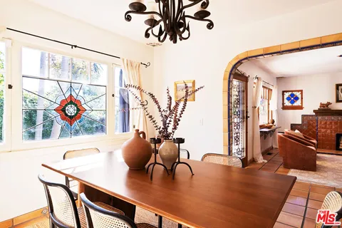 a bedroom with a bed and a chair