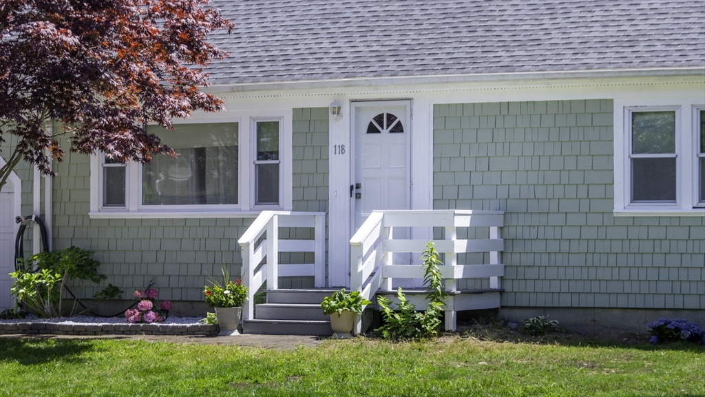 118 Walton Avenue Barnstable, MA 02601 - Photo 1 of 16 a front view of a house with a garden