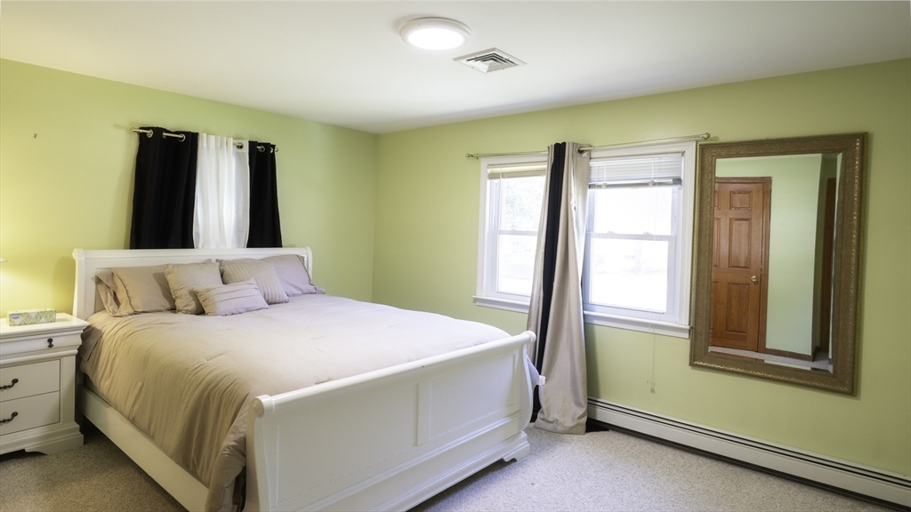 118 Walton Avenue Barnstable, MA 02601 - Photo 11 of 16 a bedroom with a bed and a window