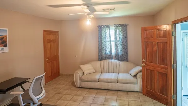 a living room with furniture and a window