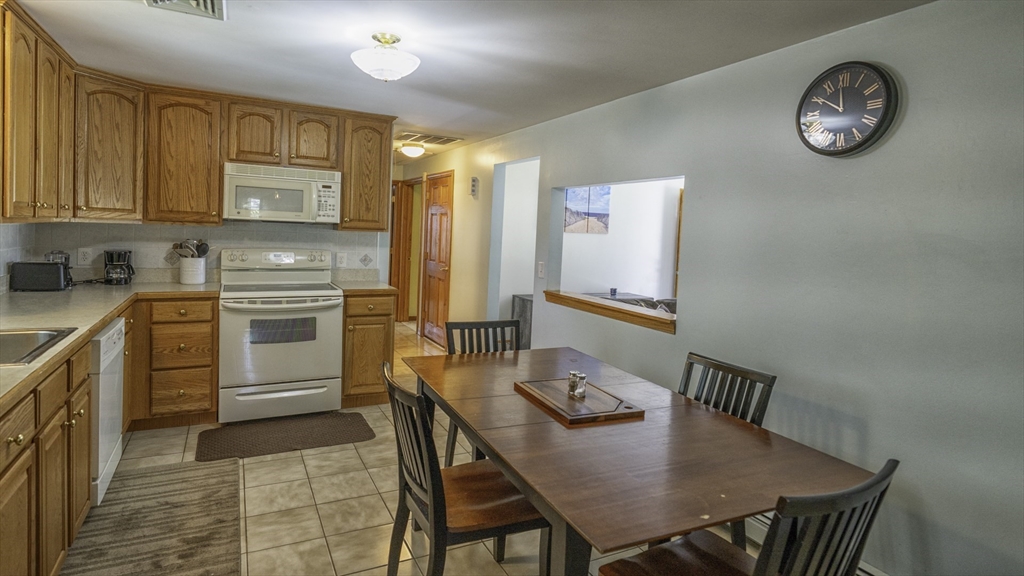 118 Walton Avenue Barnstable, MA 02601 - Photo 7 of 16 a view of a kitchen with a table and chairs