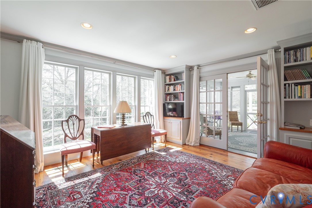 6353 Godwin Boulevard Suffolk, VA 23432 - Photo 12 of 50 Awash in natural light thanks to a bank of floor t
